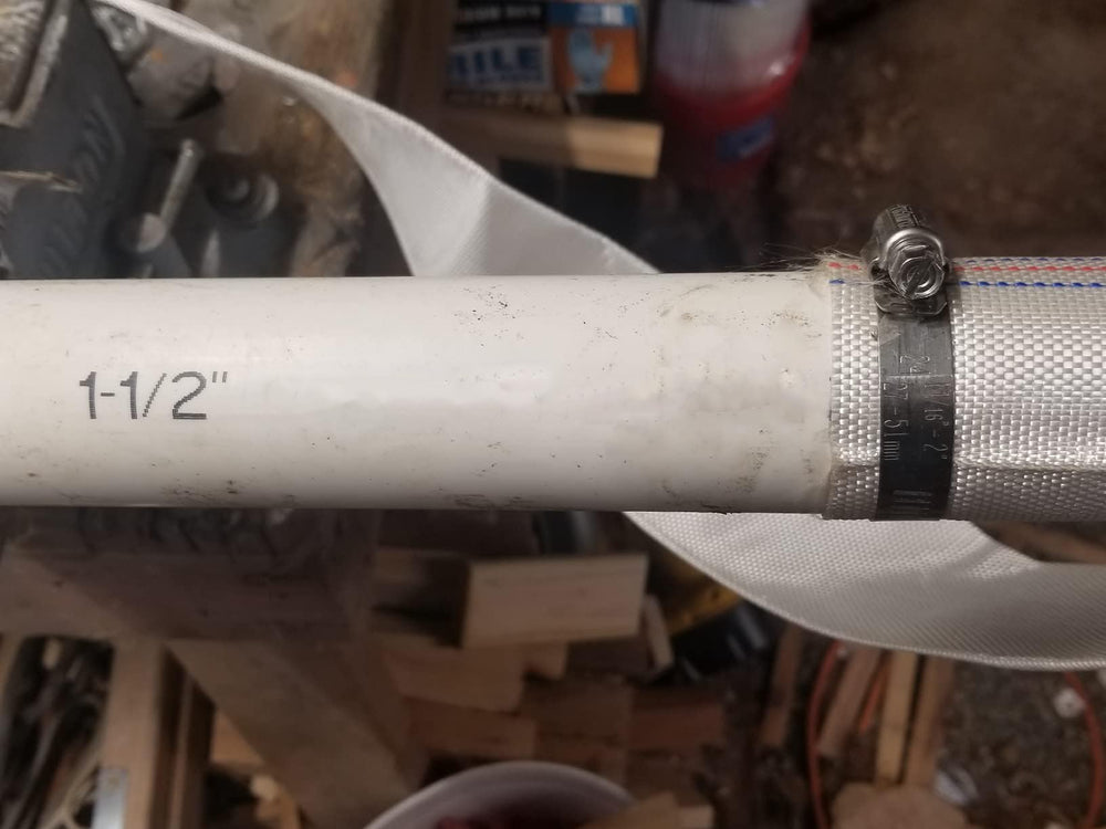 ZY-hosetube beside a person showing 65ft length and scale for long-reach discharge placement