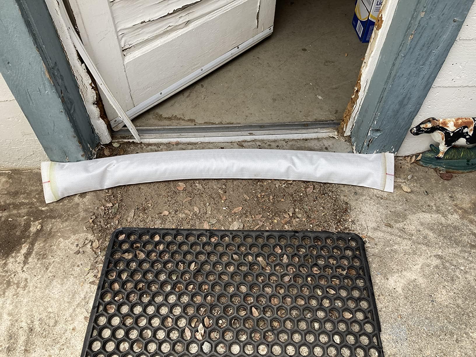 ZY-hosetube next to measuring tape showing 100ft length and scale